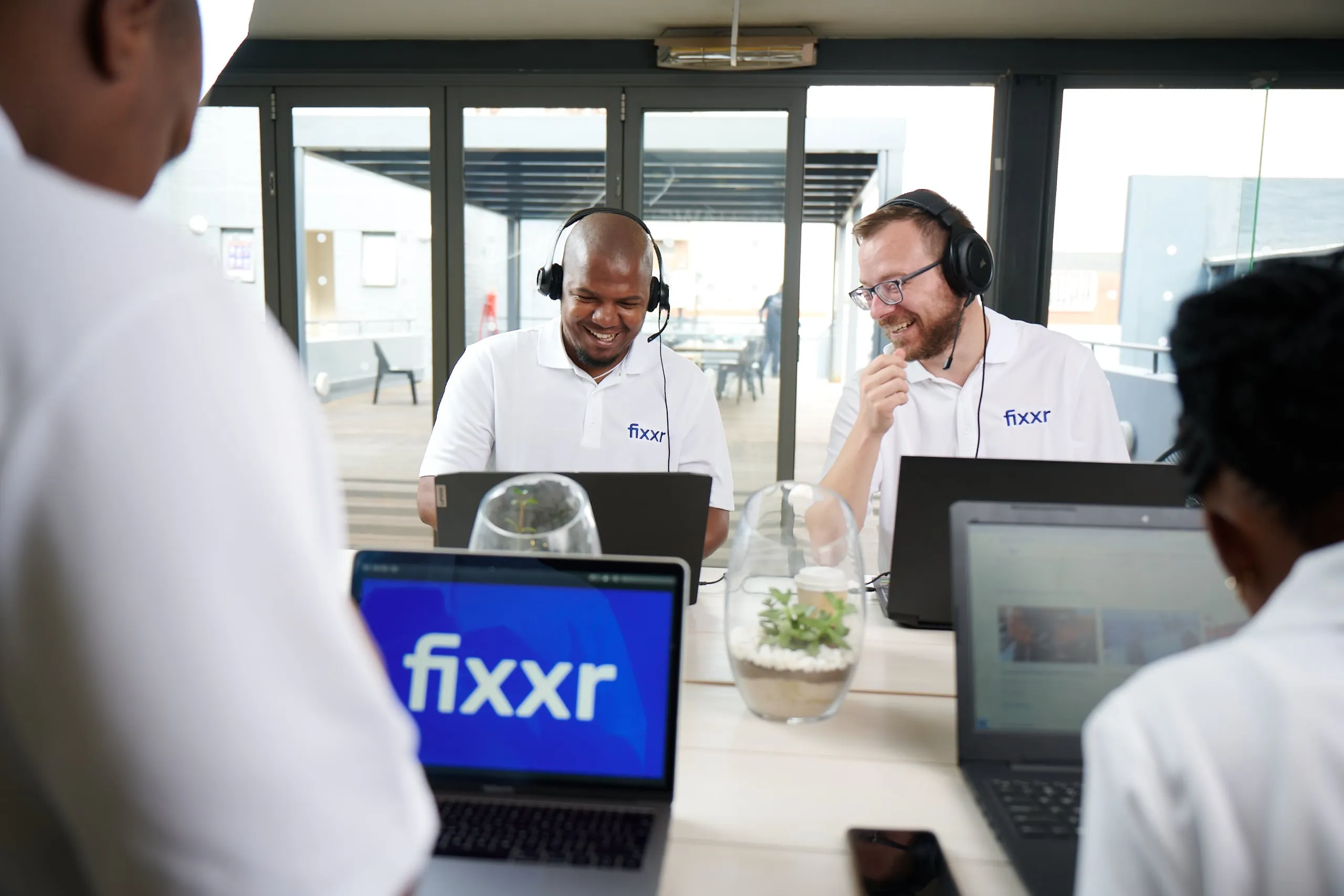Fixxr team working on laptops